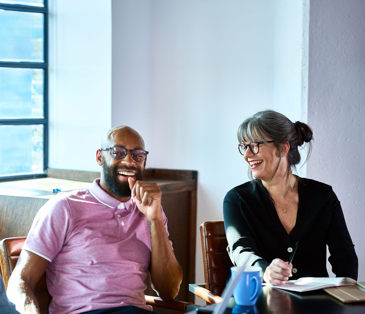 Stock photo  Co workers laughing together 01